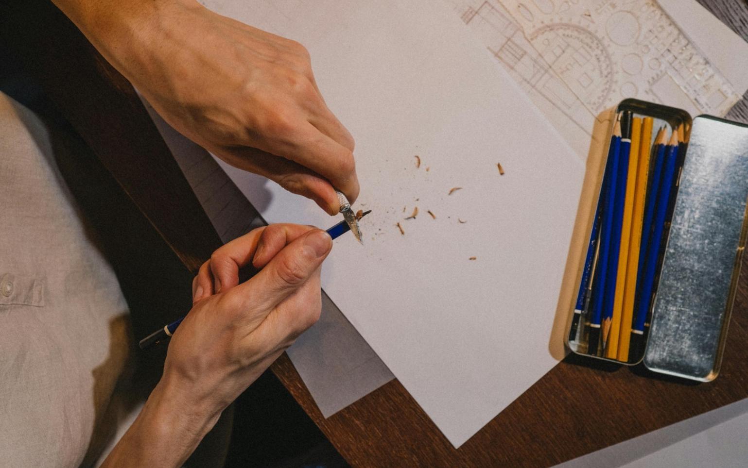 Instructor reviewing student illustration work on digital screen